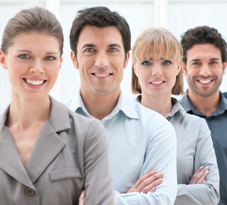 A picture of people lined up, looking very professional and smartly dressed.